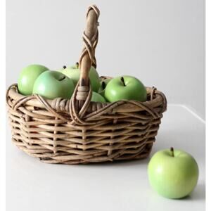 vintage woven gathering basket with a  sculptural twisted handle 14" x11"